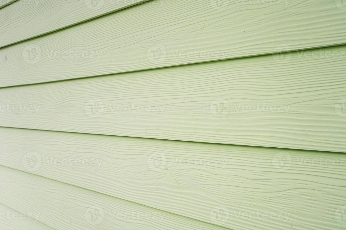 Pale Green Wood Siding with Horizontal Lines, Perfect for Exterior Wall Background or Texture, offering natural wood grain detail photo