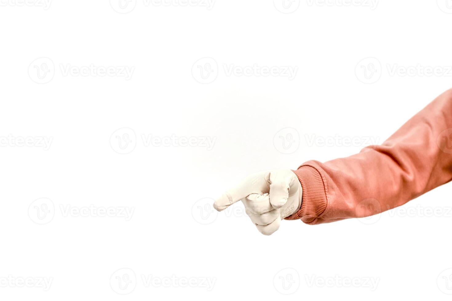 A person's arm pointing with a gloved hand towards the left side of the frame on white photo
