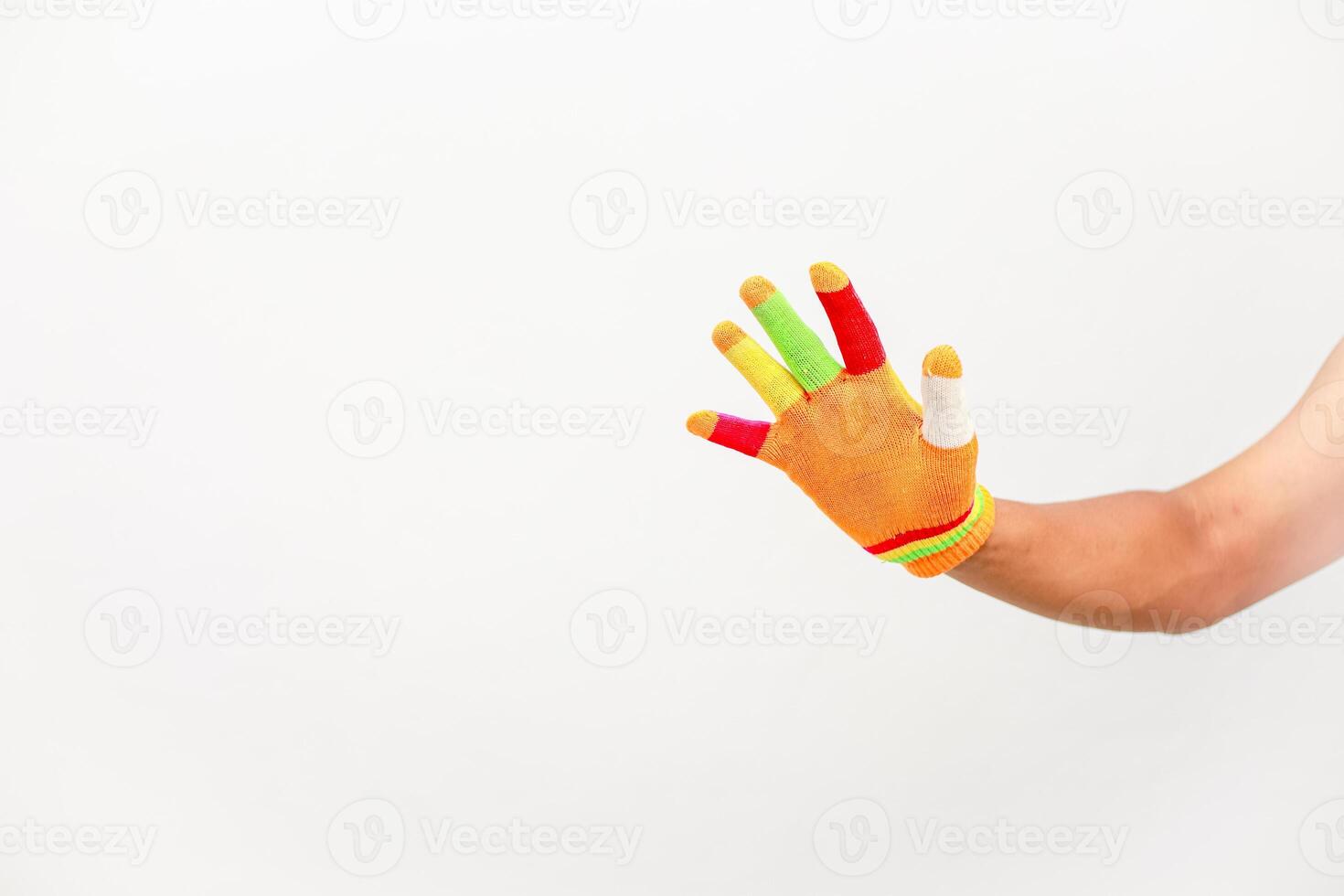 Colorful glove on hand symbolizing diversity and inclusion with a bright background ready for creative concepts photo