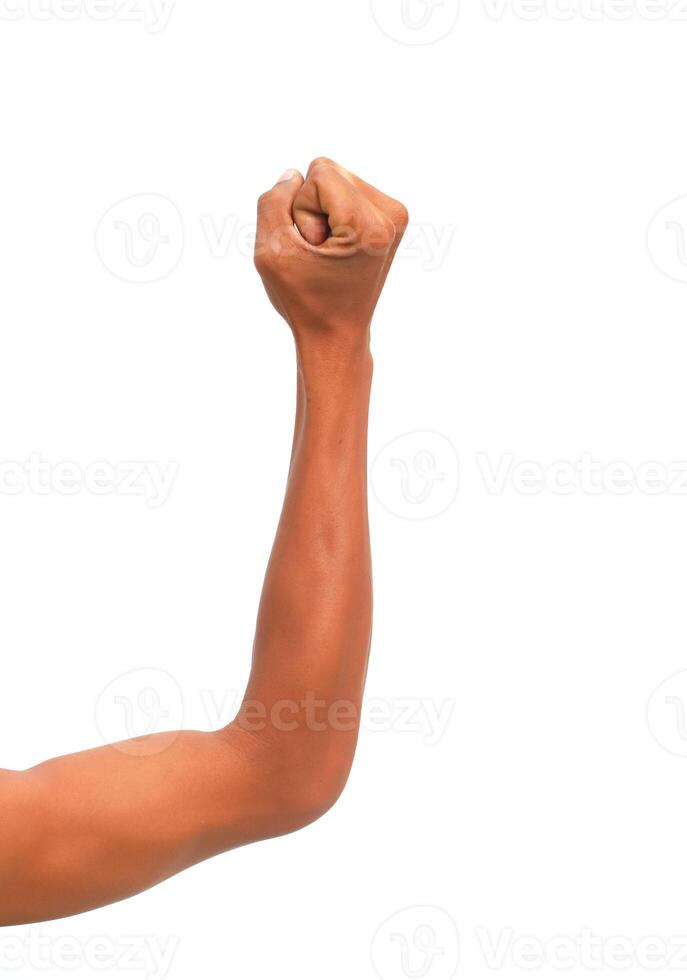 Isolated clenched fist raised in the air symbolizing strength and determination photo