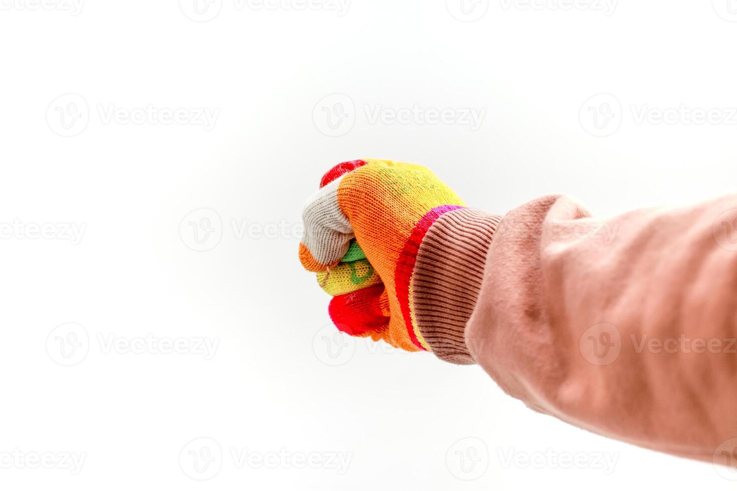 Close-up of a fist wearing a colorful work glove against a bright white background, representing protection photo