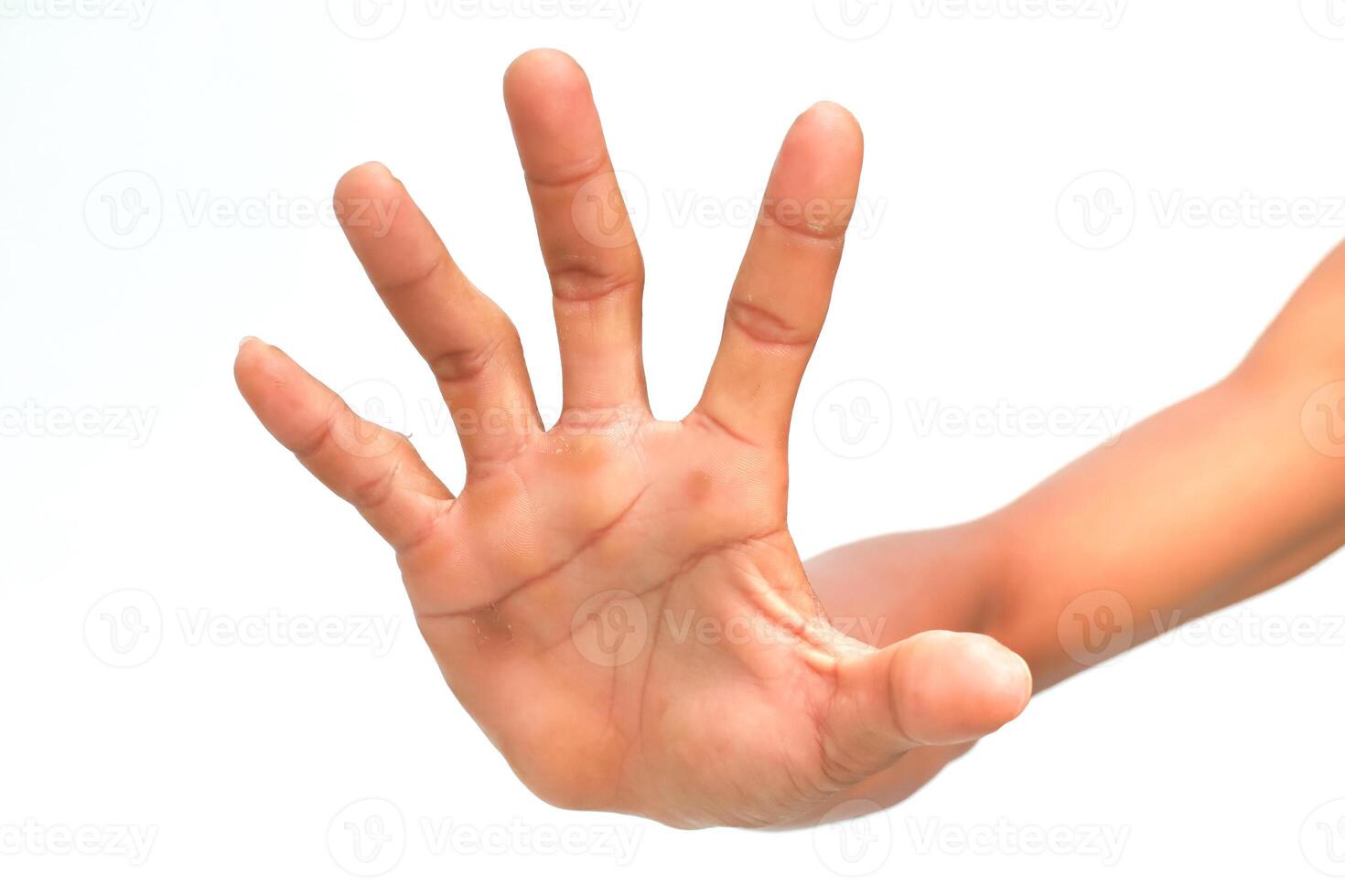 Hand gesturing stop sign with spread fingers against a clean white background for emphasis photo