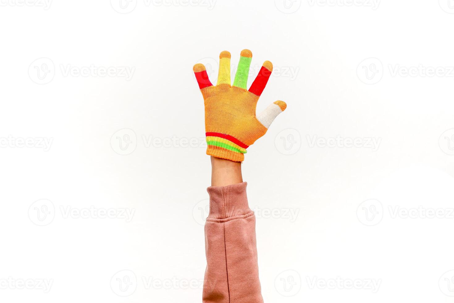 Arm Wearing a Colorful Glove Against a White Background in a Studio Setting photo