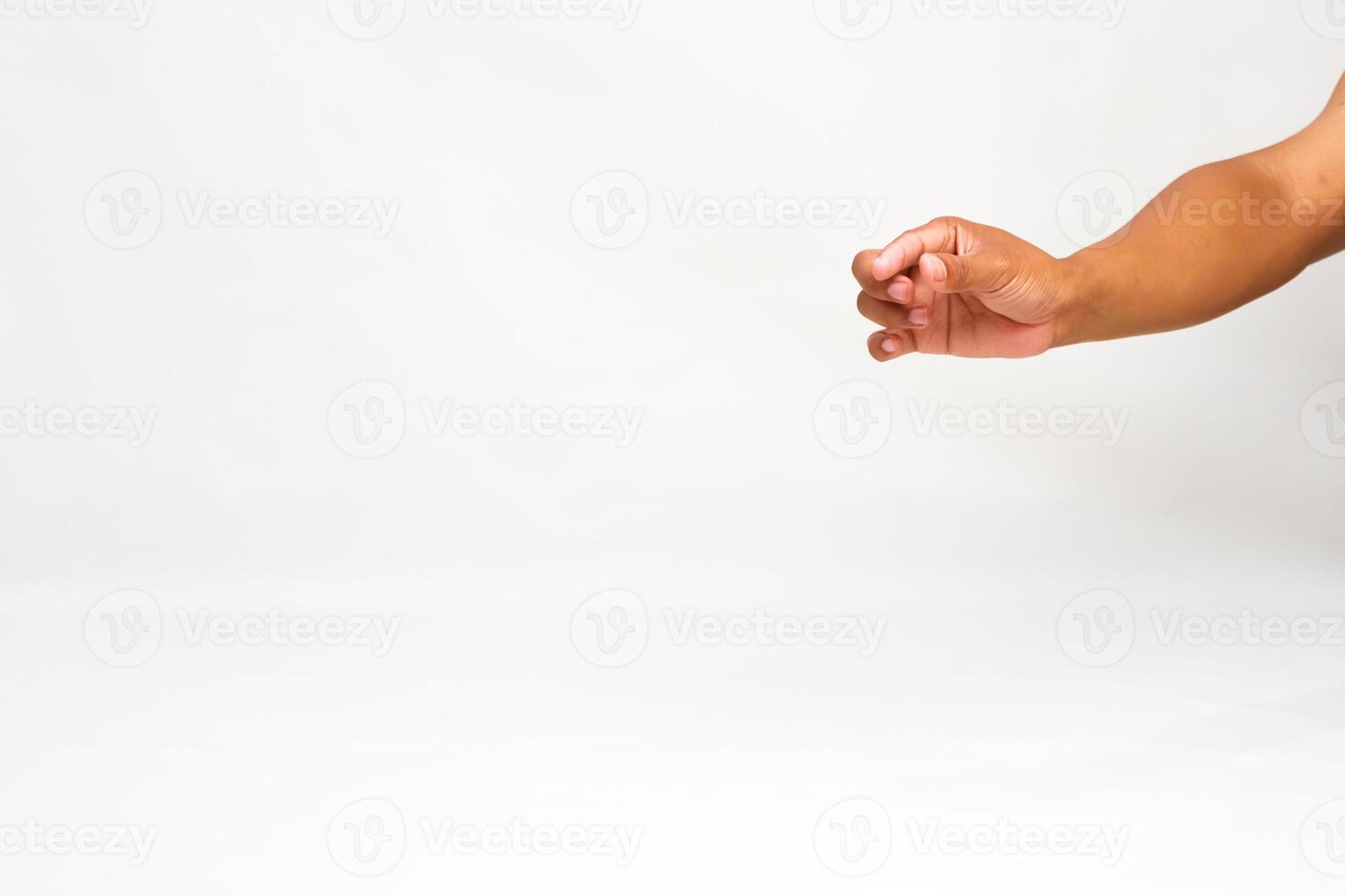 Hand reaching, with clenched fingers, in studio on white background for mockup, presentation, or graphic resource photo