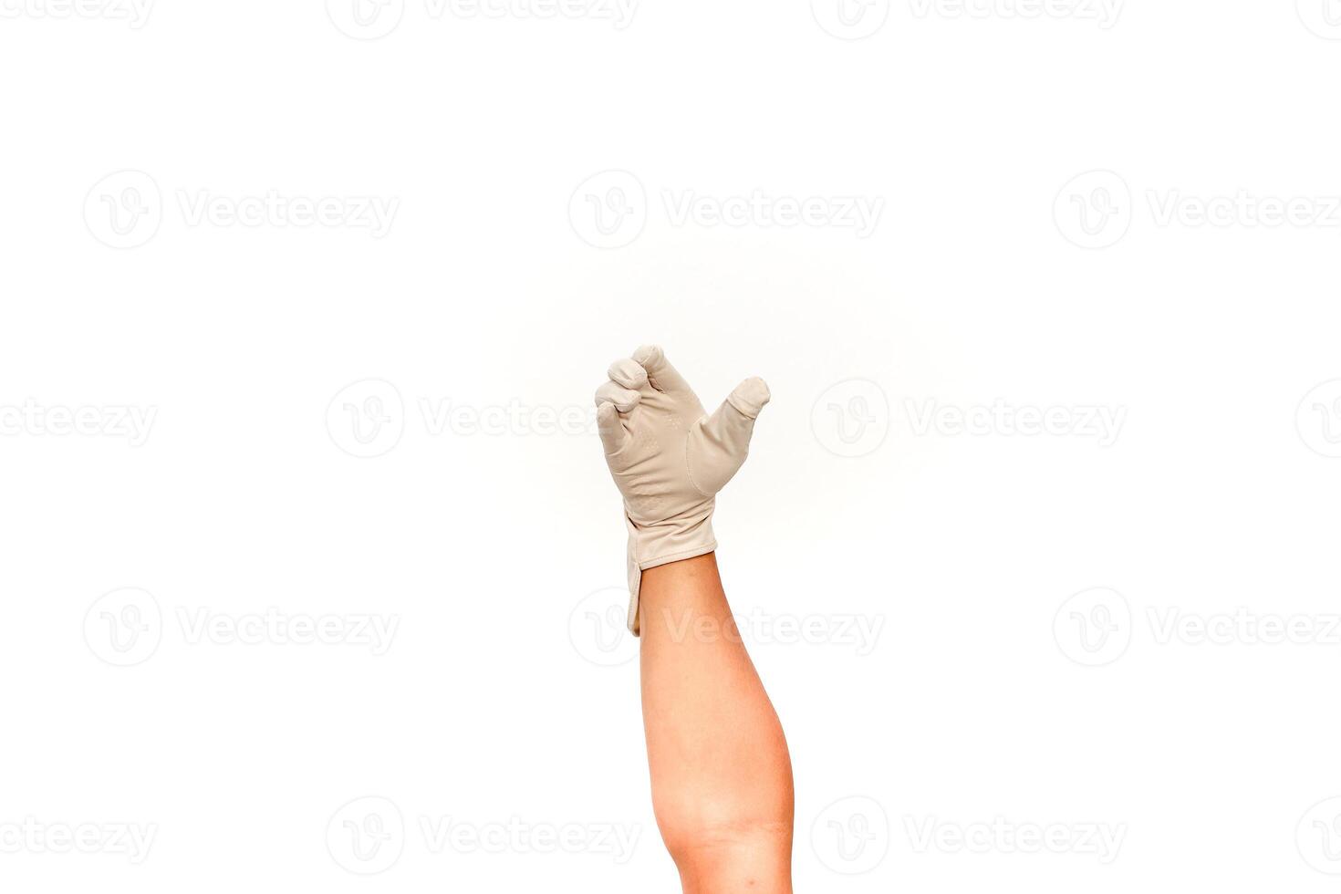 Hand in glove reaching upward against a clean, white background, creating space for design elements or product placement photo