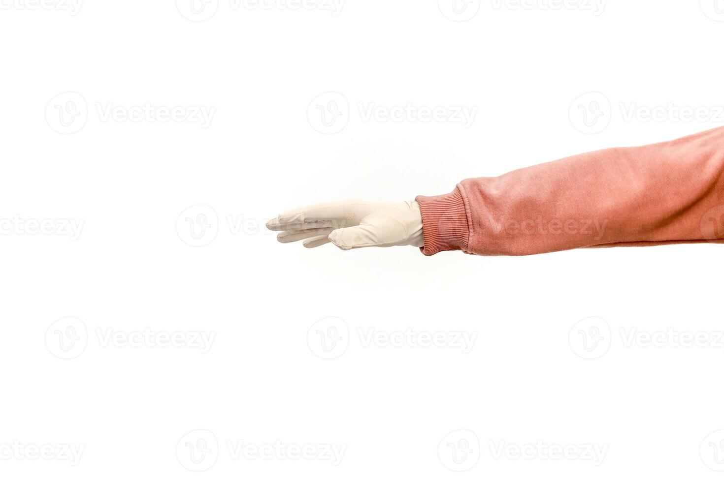 Isolated studio shot of a hand in a latex glove and pink sweater on white background photo