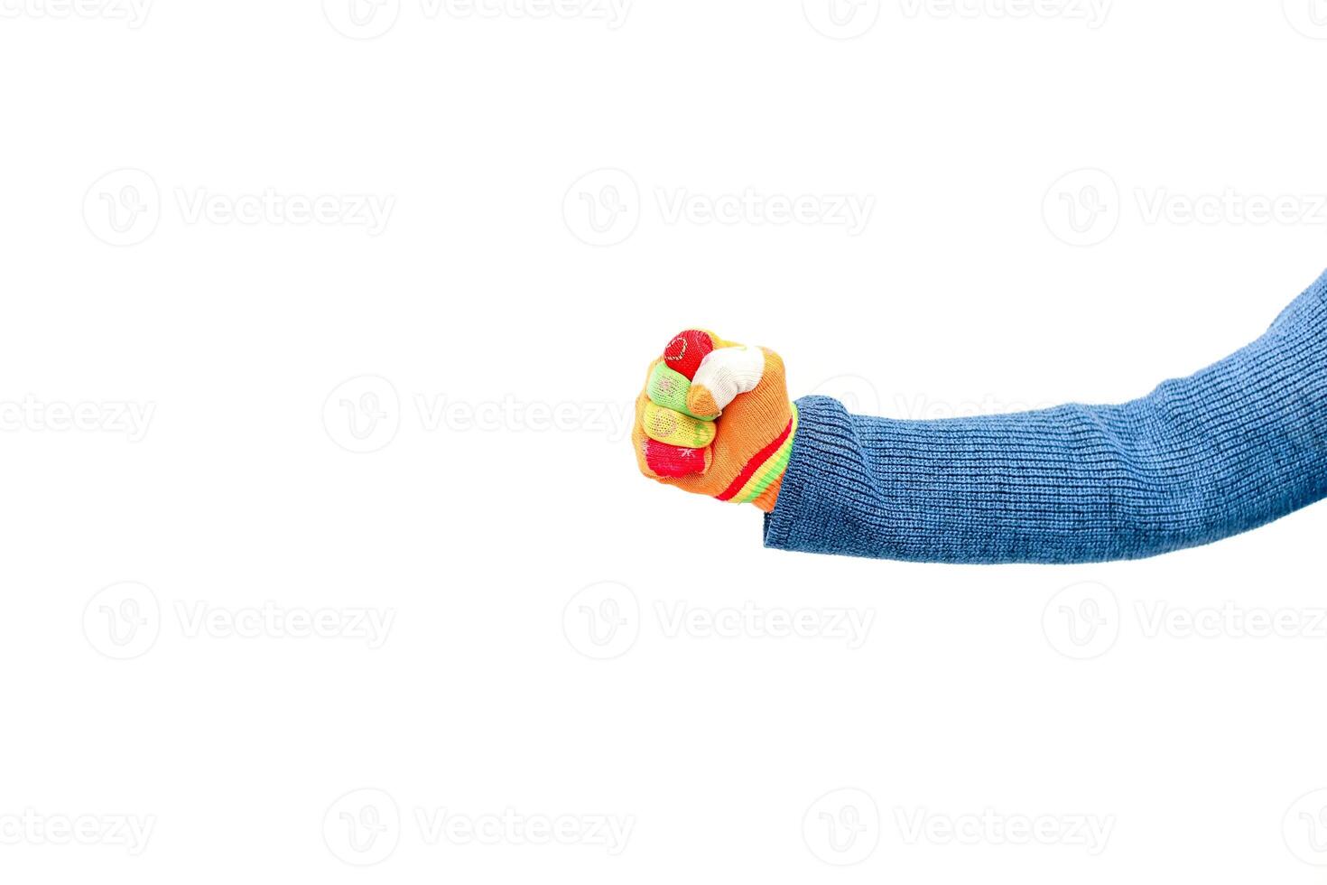 Close-up of a Hand Squeezing a Colorful Stress Ball Against a White Background photo