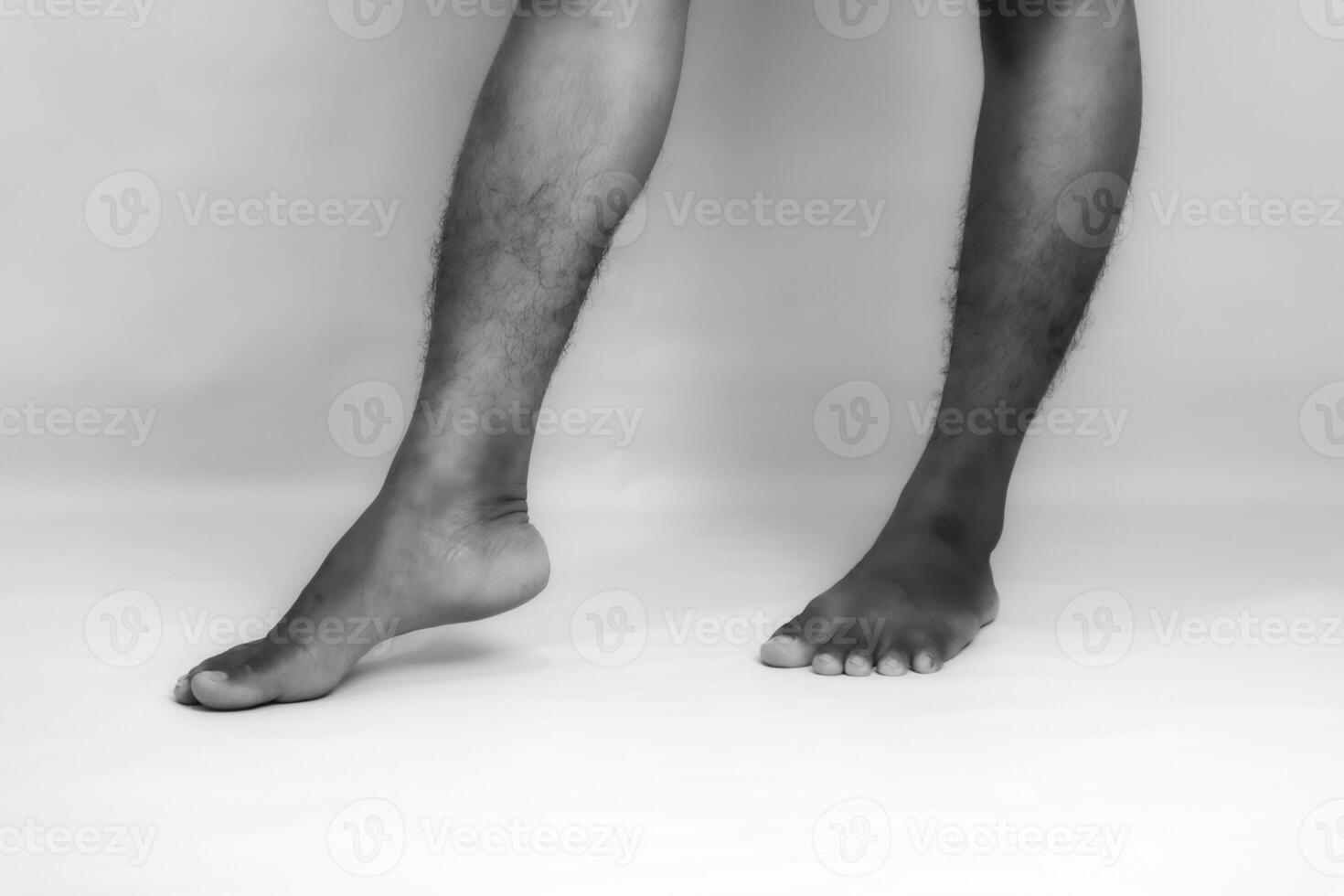 Monochromatic Study of Human Legs and Feet, Exploring Texture and Movement photo