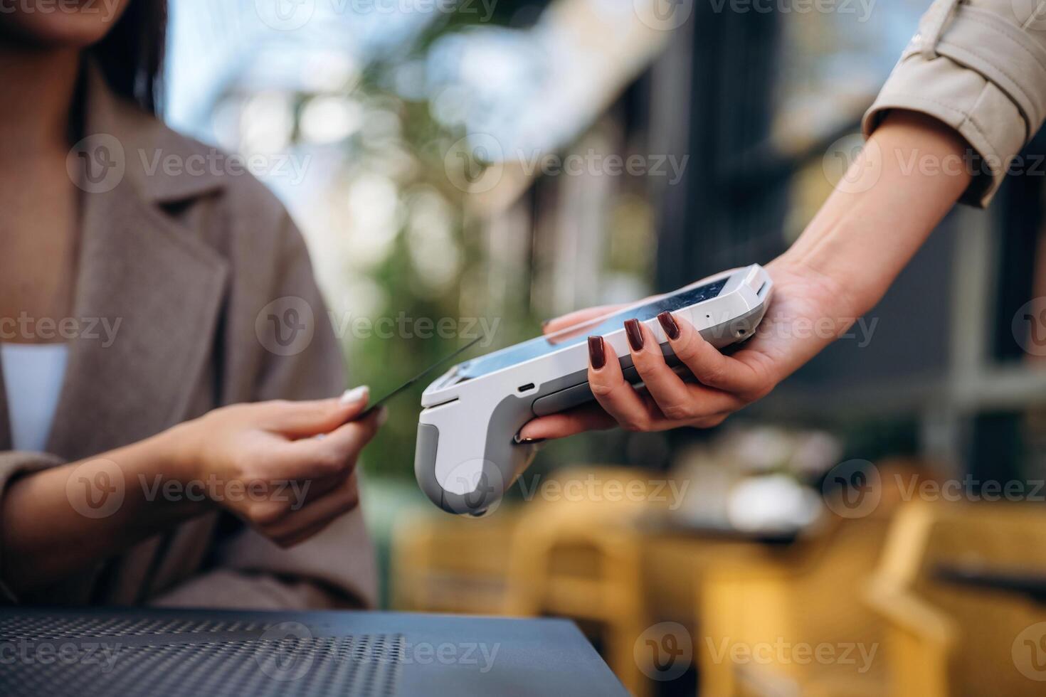 Customer using card for payment photo
