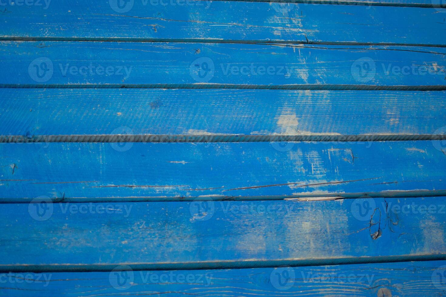 Weathered Blue Wooden Planks with Visible Grain and Texture photo
