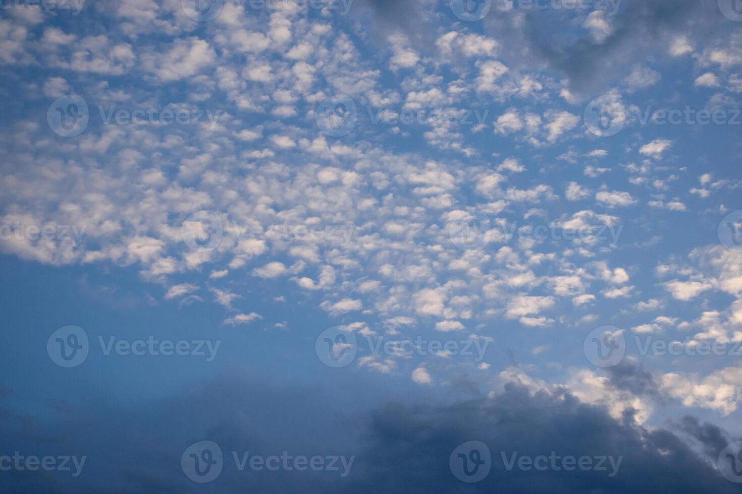 Expansive Sky with Fluffy White and Dark Cloud Formations photo