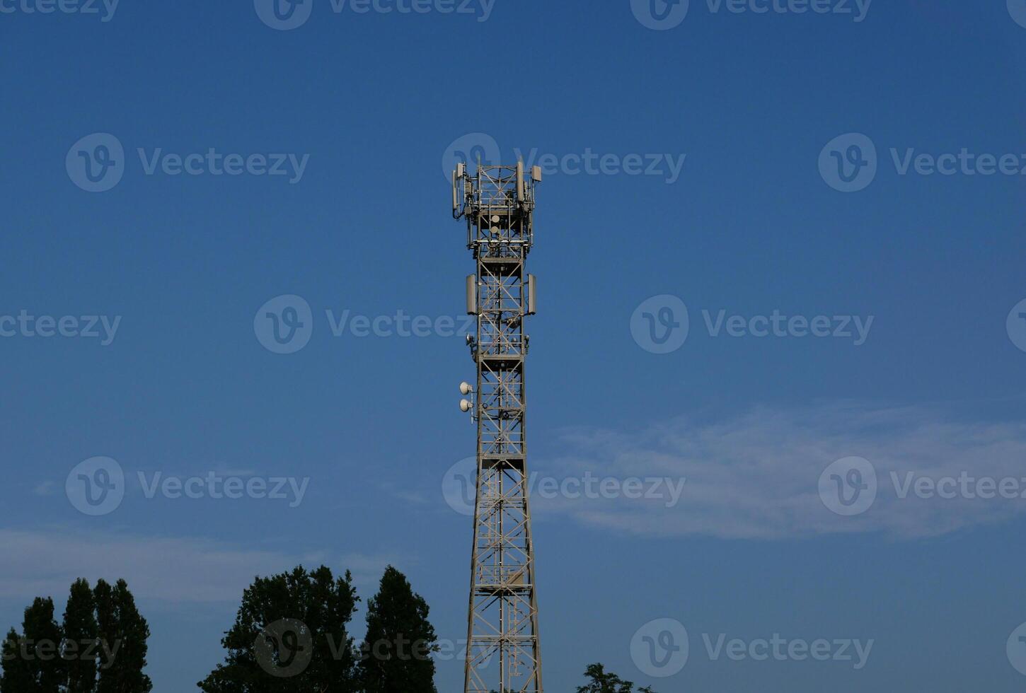 communication tower mast over blue sky photo