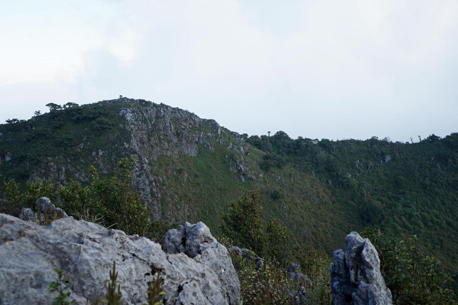 Nature landscape window of green mountain summit range and rocky hill park photo