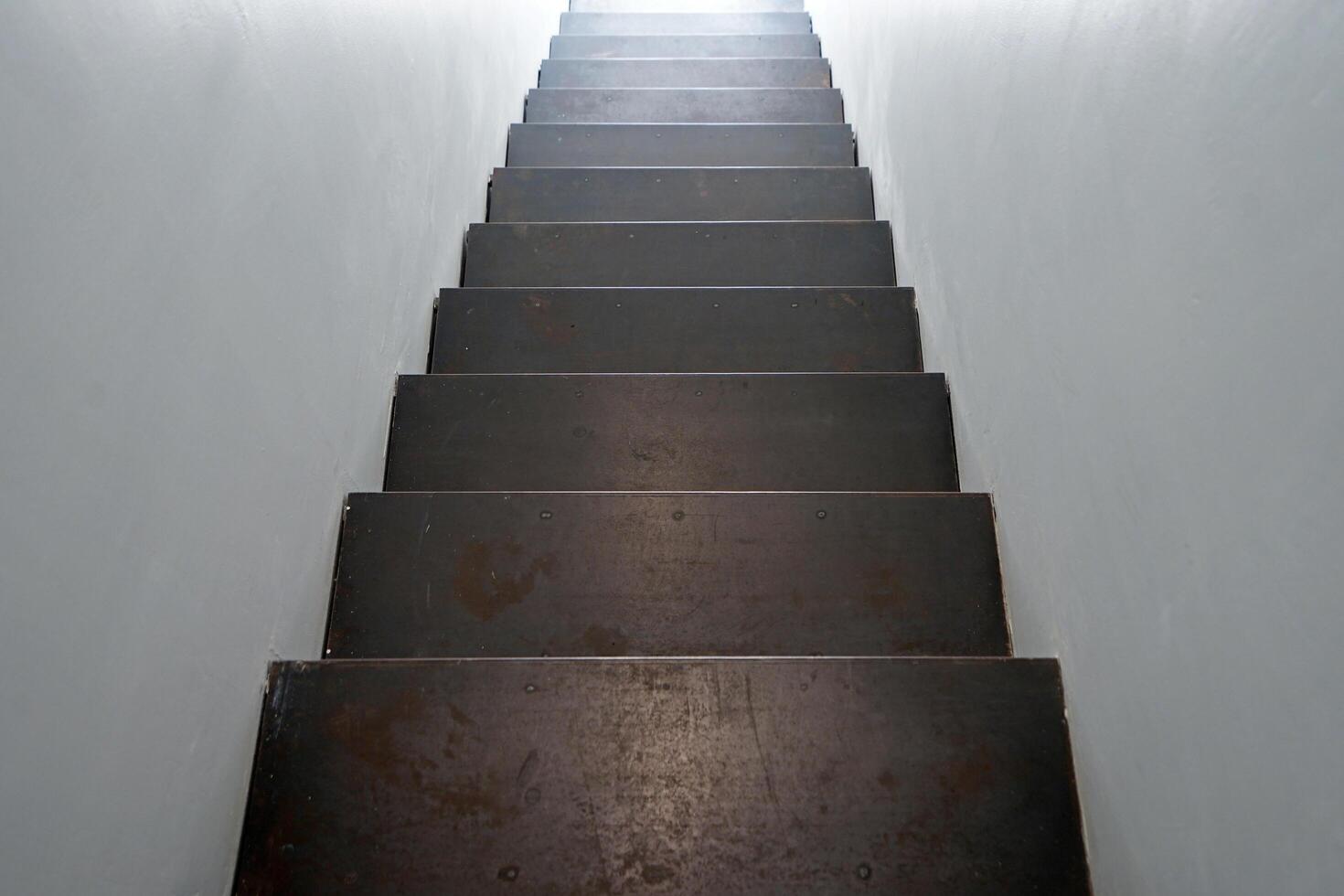 Interior decoration and design of white wall room decorated with metal and iron staircase in industrial loft style photo