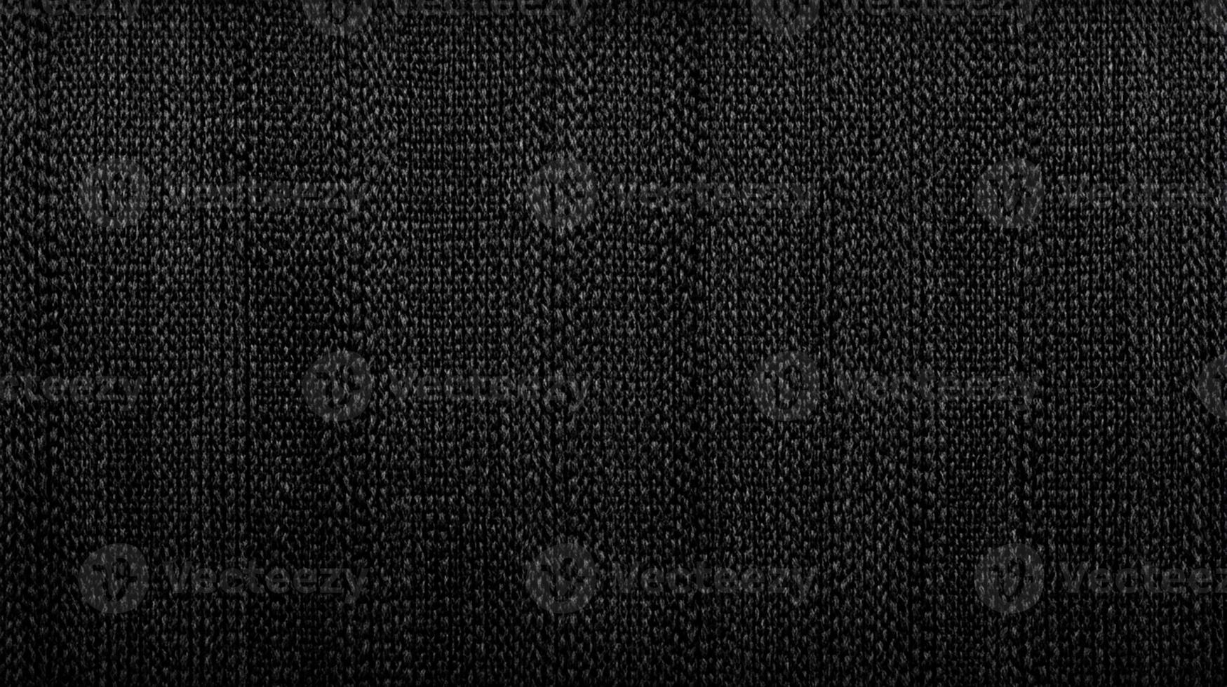 Dark Textured Black Fabric with Vertical Knit Pattern photo