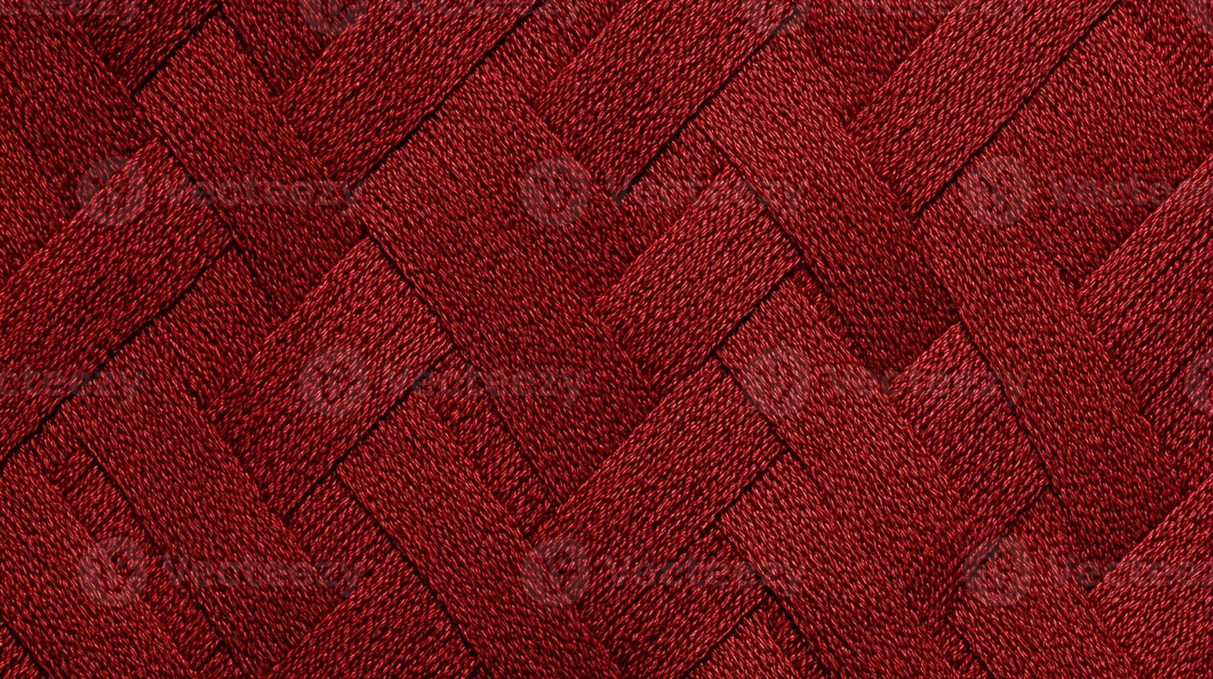 Close-up of Red Woven Fabric Texture with Intricate Pattern photo