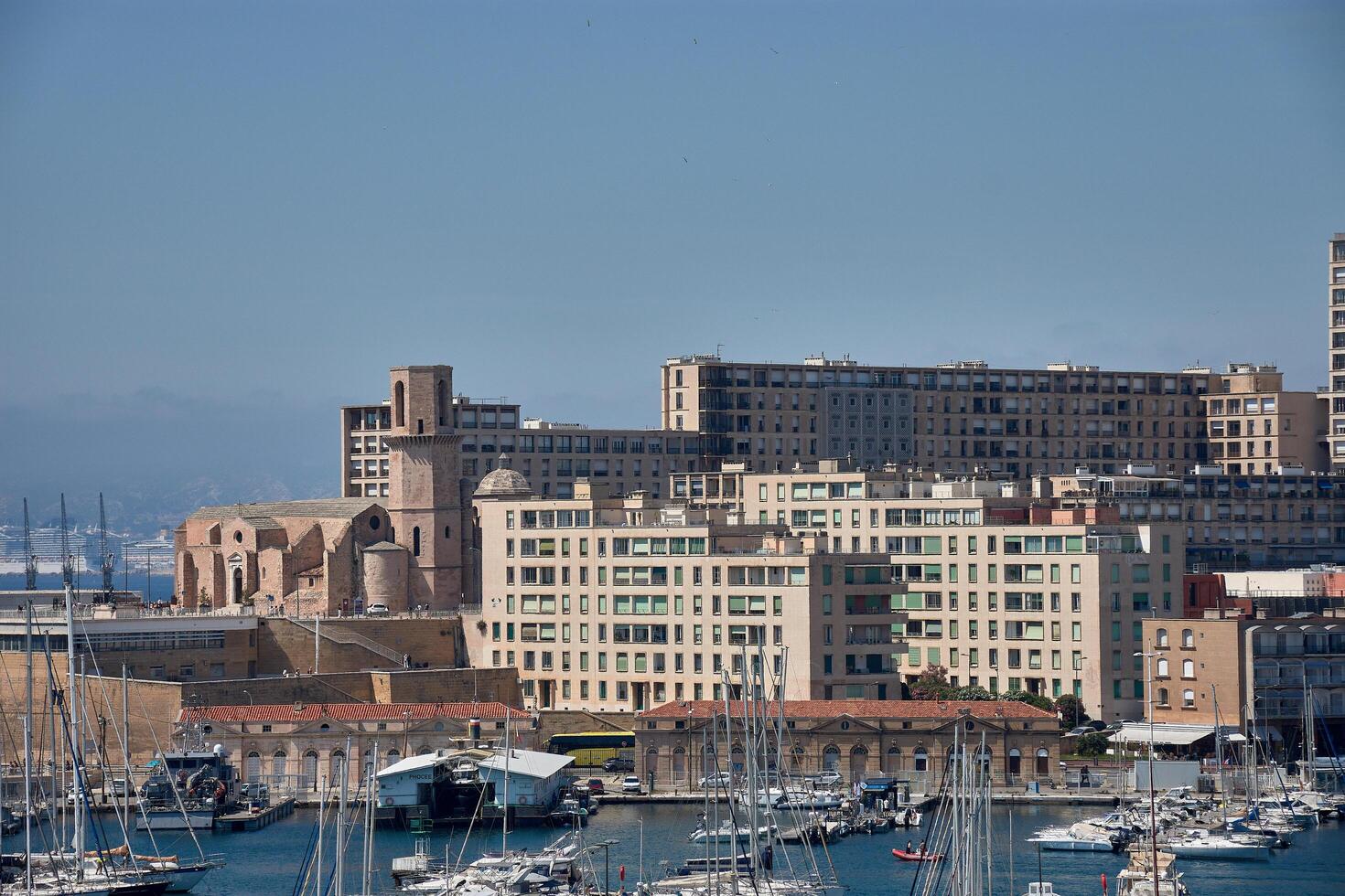 Marsella, Francia, 31 de mayo de 2025,Urban scene with the Port of Marseille, sailboats, and activity on the Old Town waterfront in a Mediterranean atmosphere photo