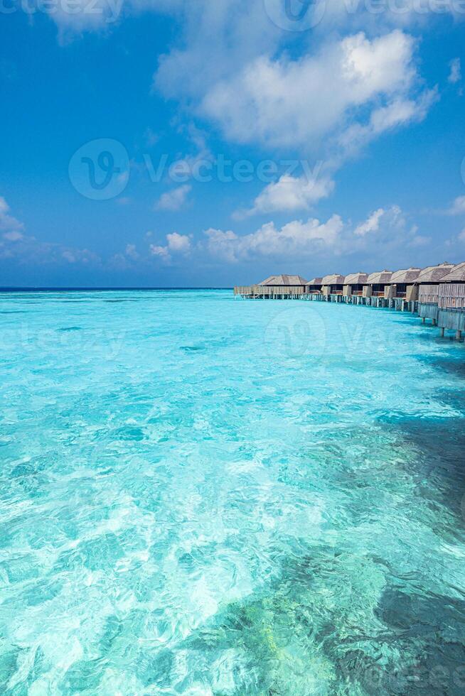 Tropical ocean view with bungalows photo
