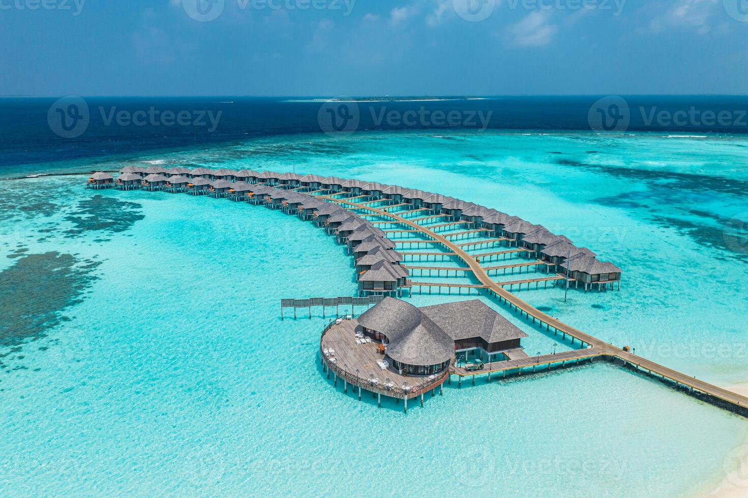 Overwater bungalows in turquoise waters photo