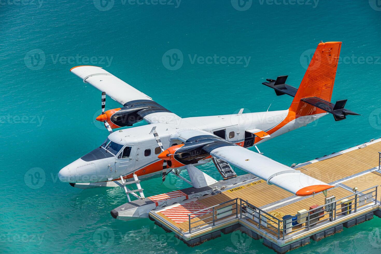 Seaplane on a turquoise dock photo