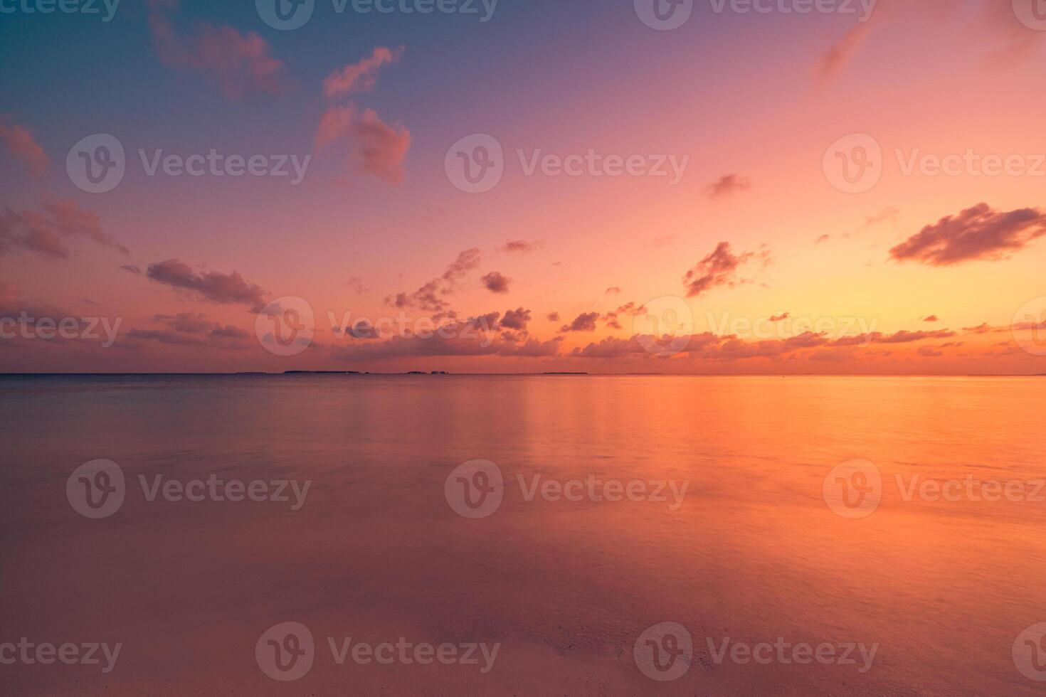 Sunset beach closeup featuring expansive seascape, colorful horizon, and dramatic sky, tranquil tropical shore inspiring dreamy travel, summer getaway sunrise nature escape photo