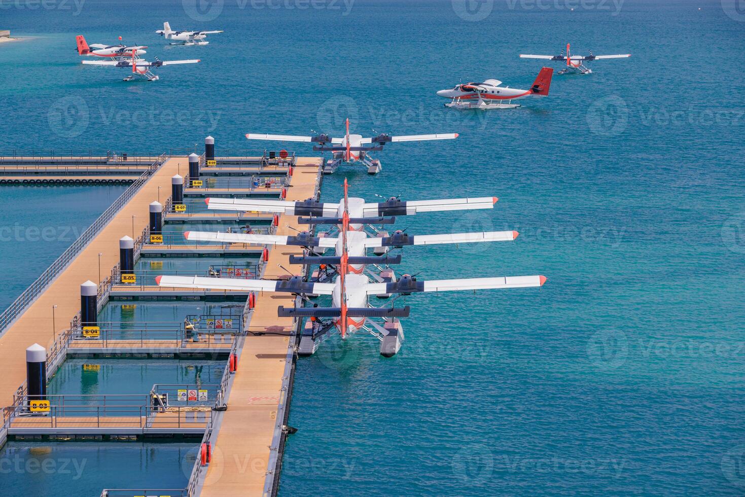 Seaplanes at a marine dock photo