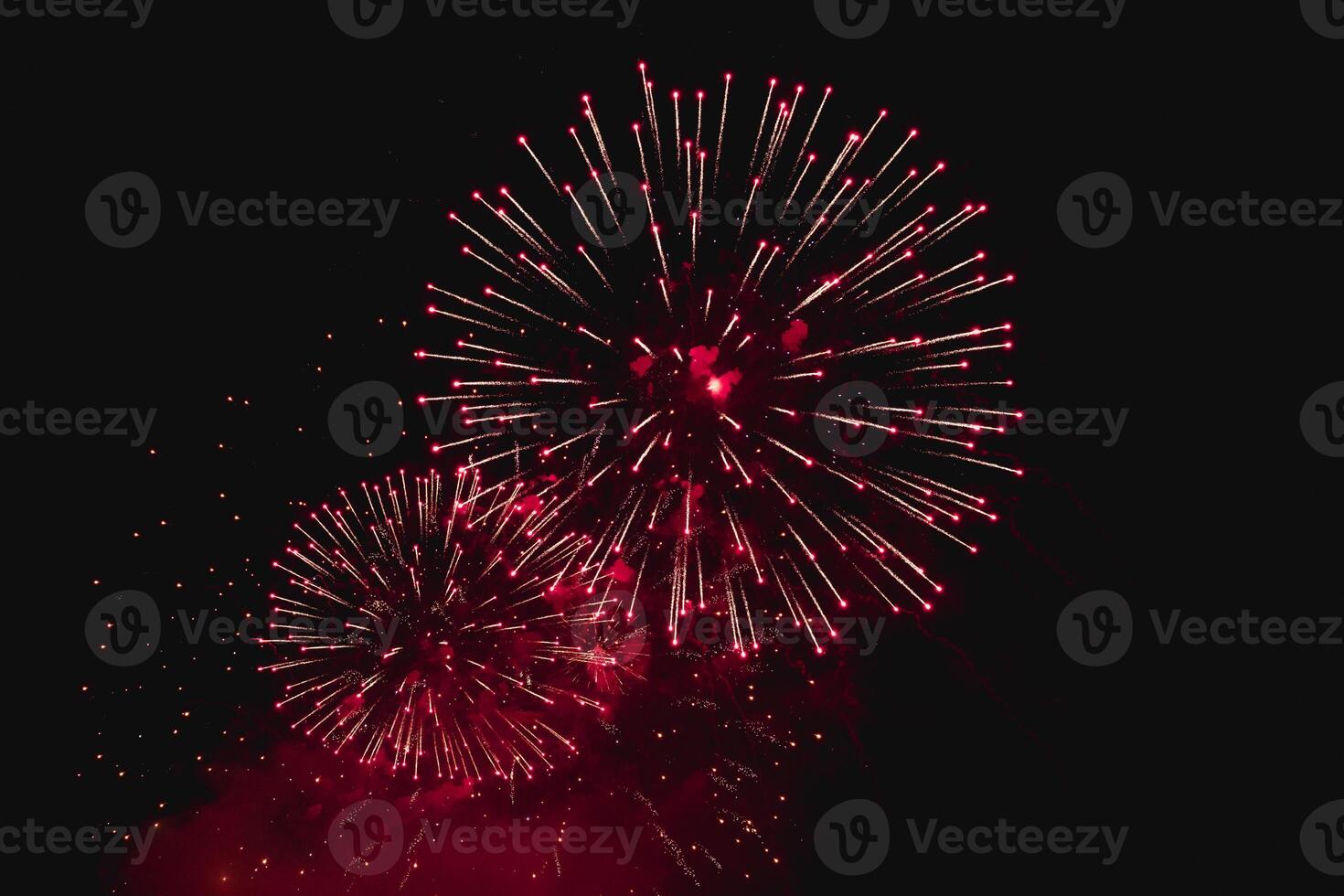 Brilliant Red and Gold Fireworks Illuminating the Dark Sky photo