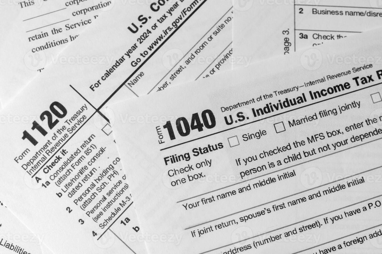 Close-up of U.S. tax forms used for annual income reporting. Tax season, government paperwork, and financial documentation concept. photo