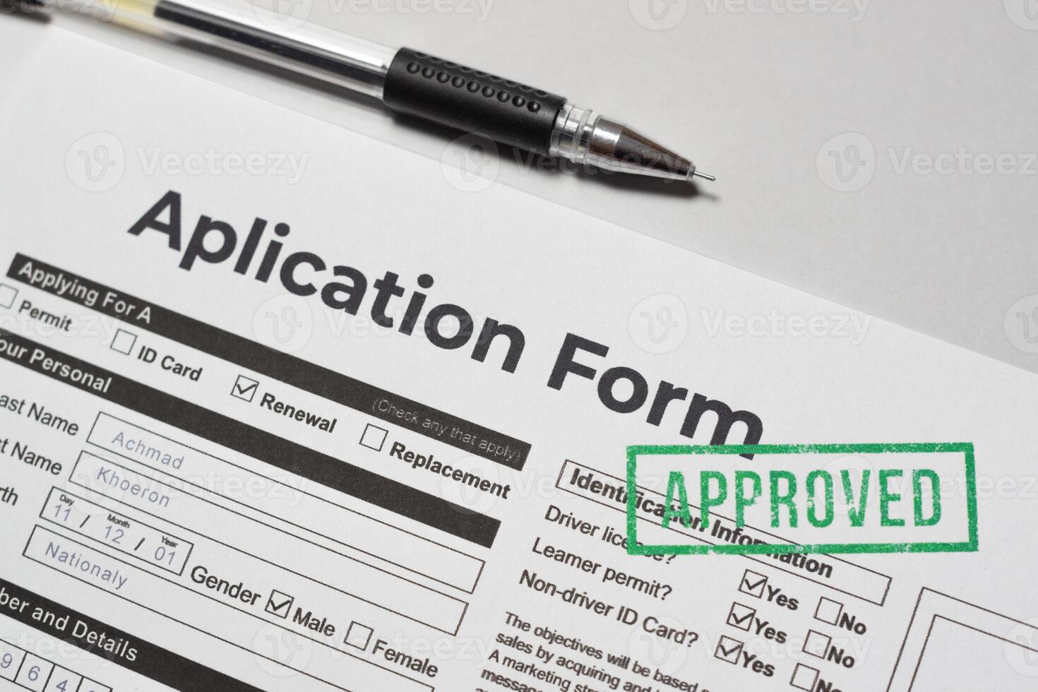Application Approved Stamped Document Closeup on table photo