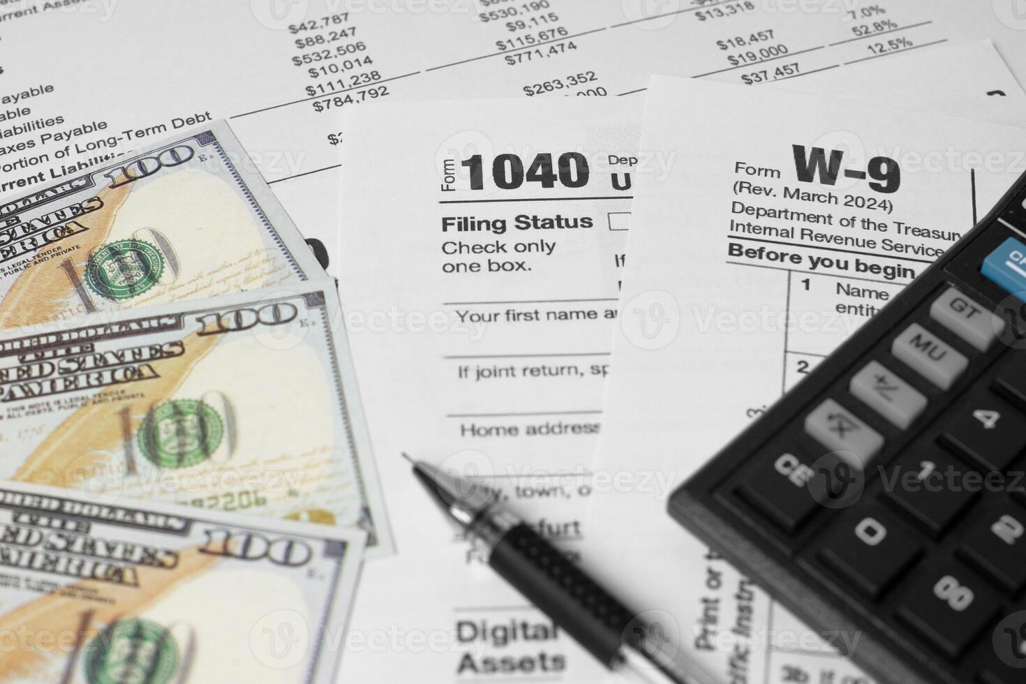 Financial planning concept with U.S. tax form 1040, pen, calculator, and spread of dollar bills. Symbolizing income tax return, budgeting, accounting, and personal finance management. photo