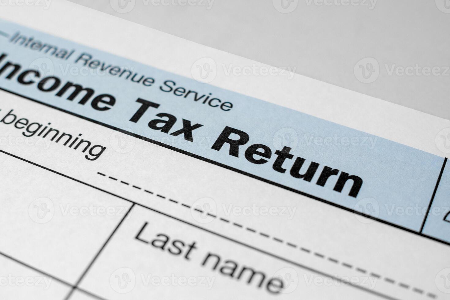 Close-up view of income tax return form. Financial document for filing annual taxes with detailed personal and income information photo