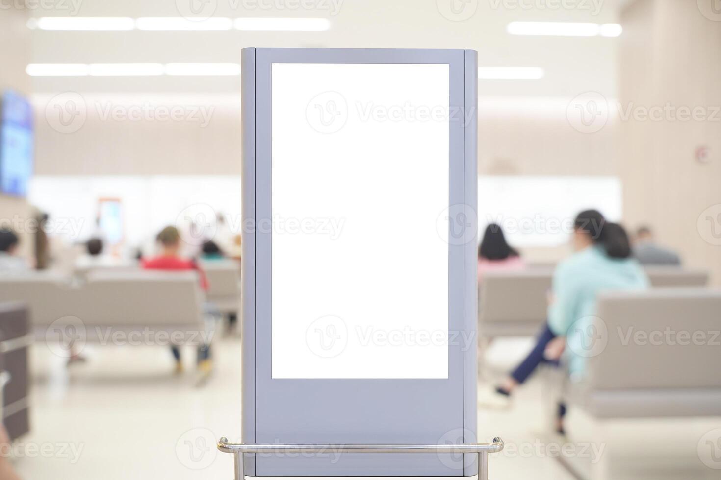 Blank vertical signage mockup in hospital waiting area with patient blur background and clean modern interior photo