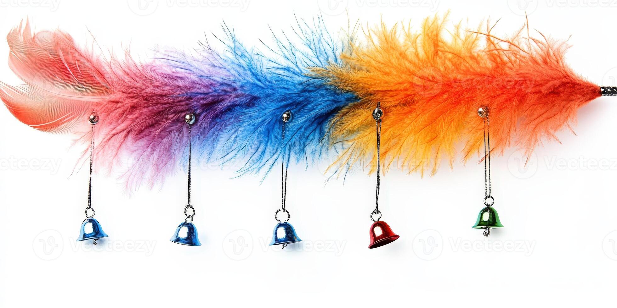 A colorful feather with bells hanging from it. photo