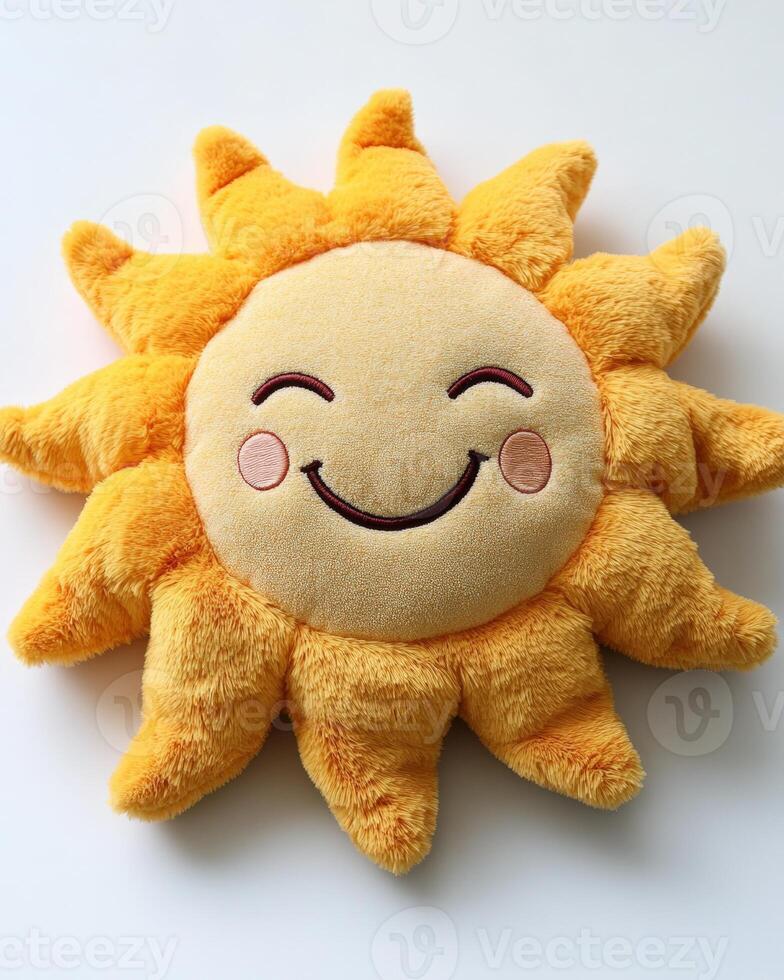 A yellow sun shaped pillow with a smiley face. photo