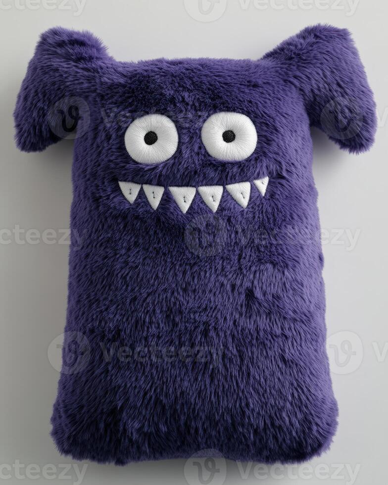 A purple monster pillow with eyes and a big nose. photo