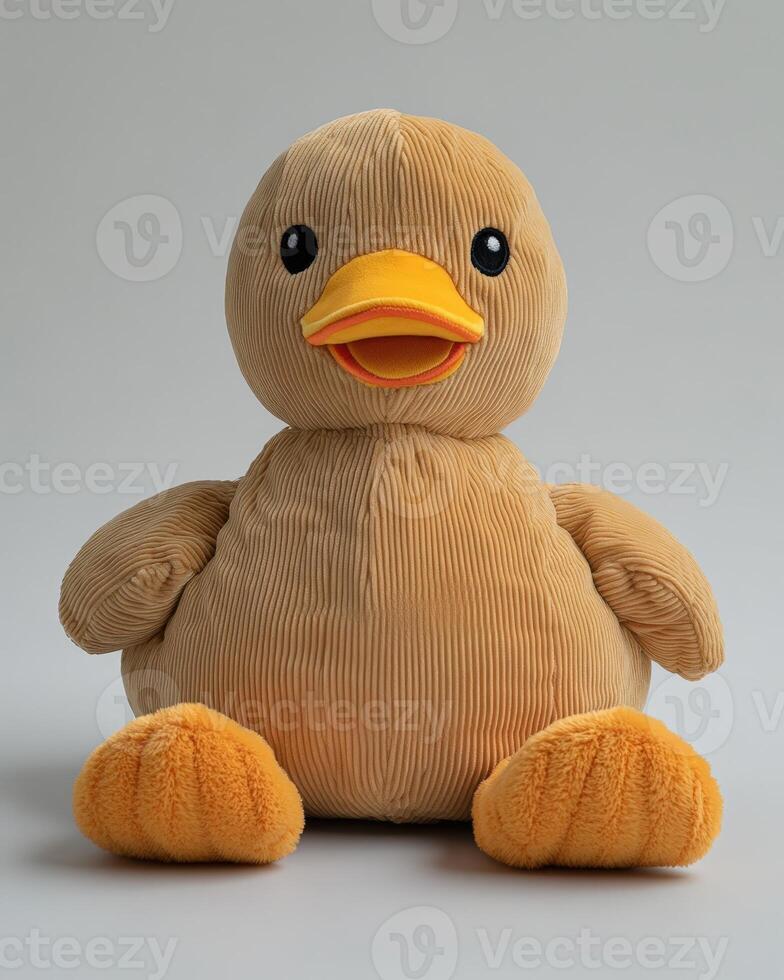 A stuffed duck sitting on a white surface photo
