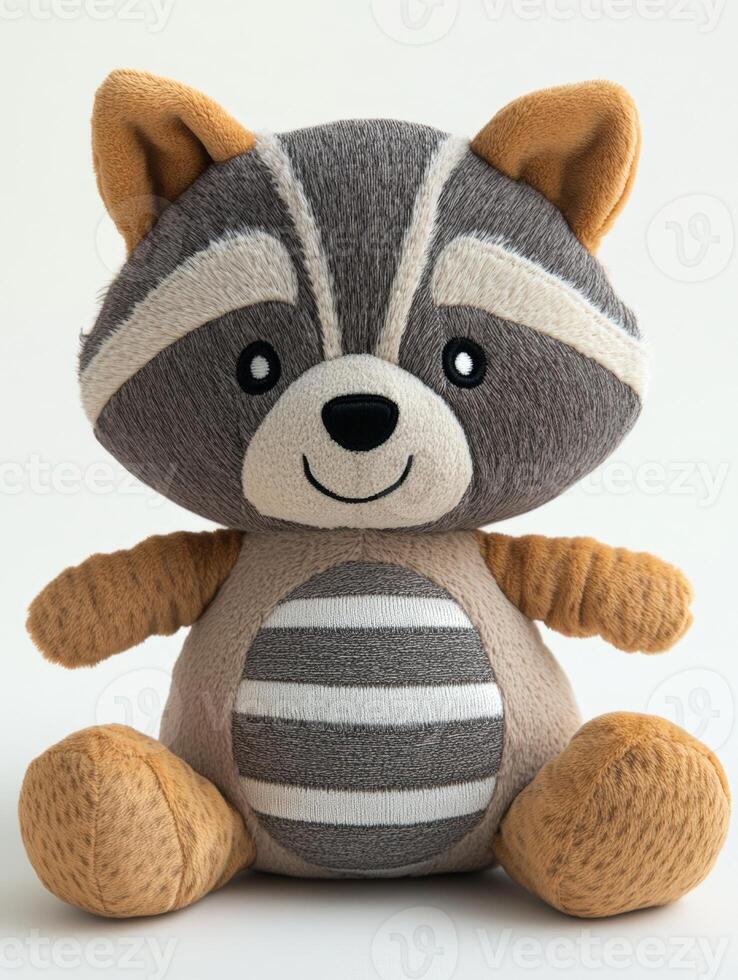 A stuffed raccoon sitting on a white surface photo