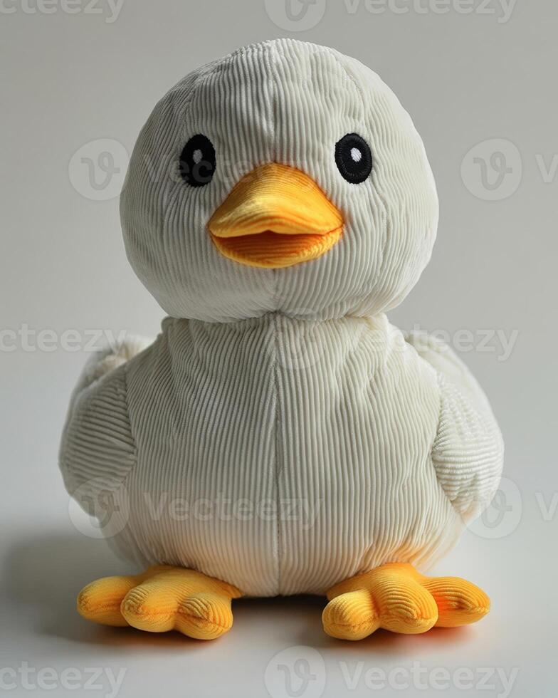 A stuffed white duck with yellow feet photo