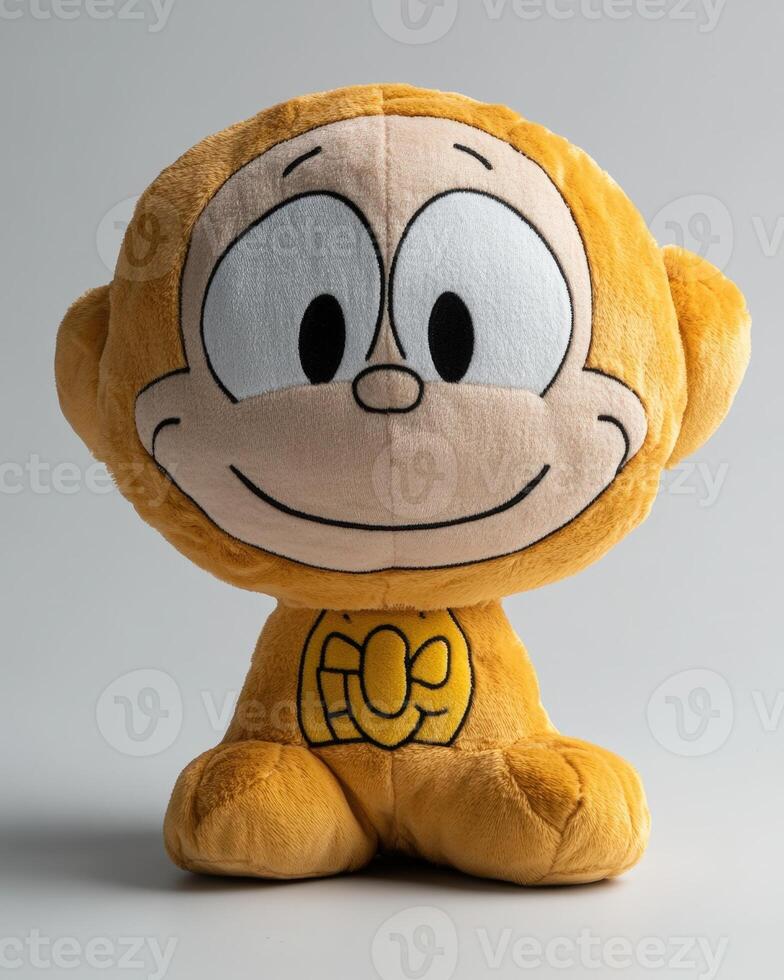 A stuffed monkey toy with a yellow face photo