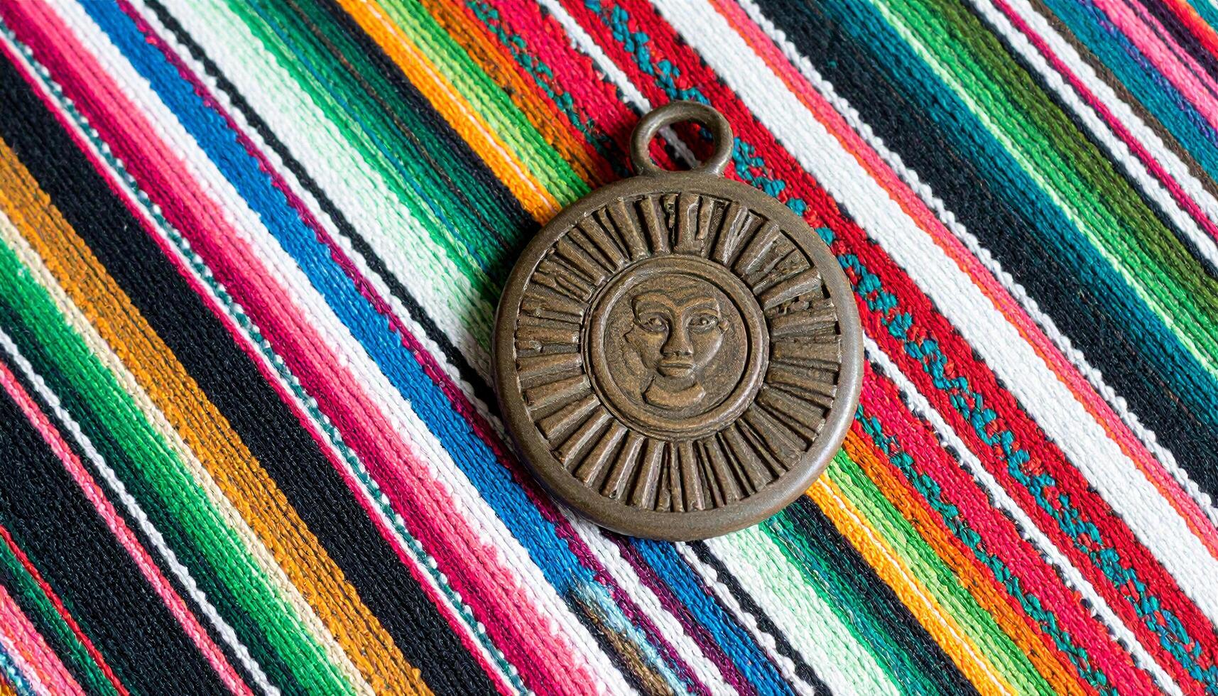Mayan Seal Fragment On Guatemalan Textile photo