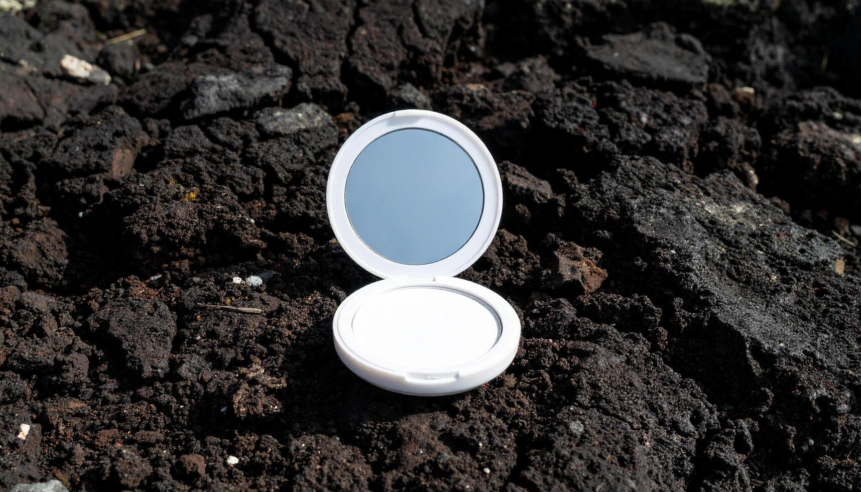 Mirror On Volcanic Slab With Crater Texture photo