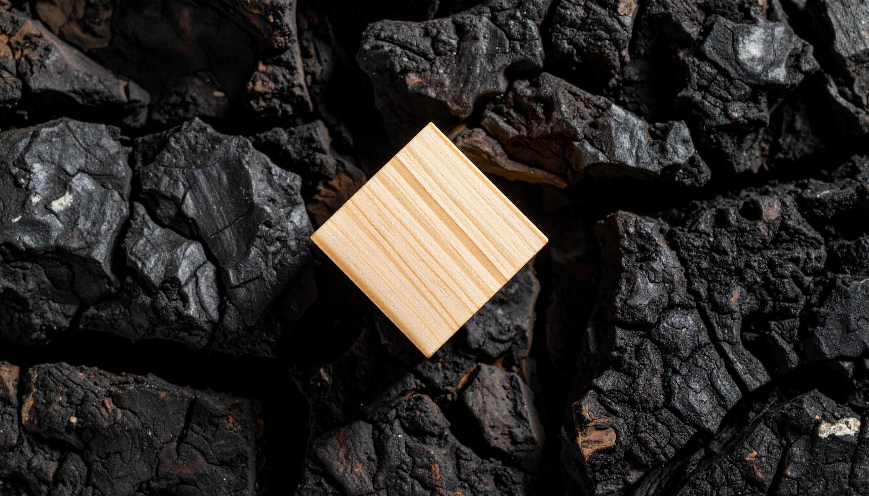Wooden Cube On Volcanic Rock photo