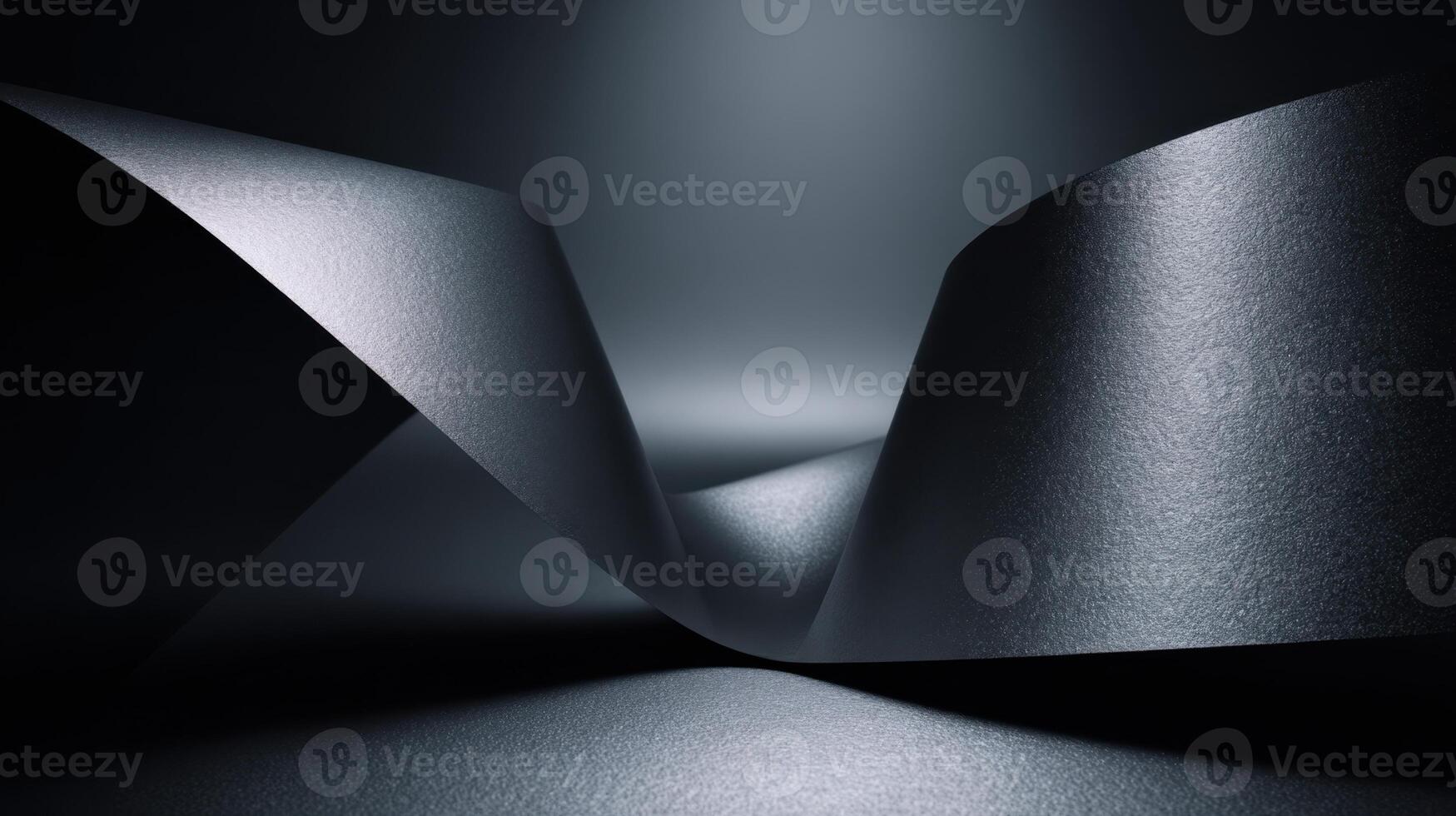 Abstract monochrome image featuring flowing dark paper in a minimalist composition showcasing light and shadow interplay photo