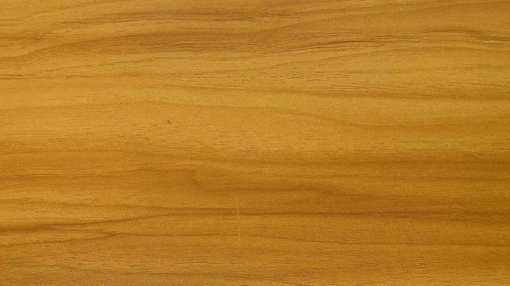 A close up of a wooden surface with a light brown stain photo