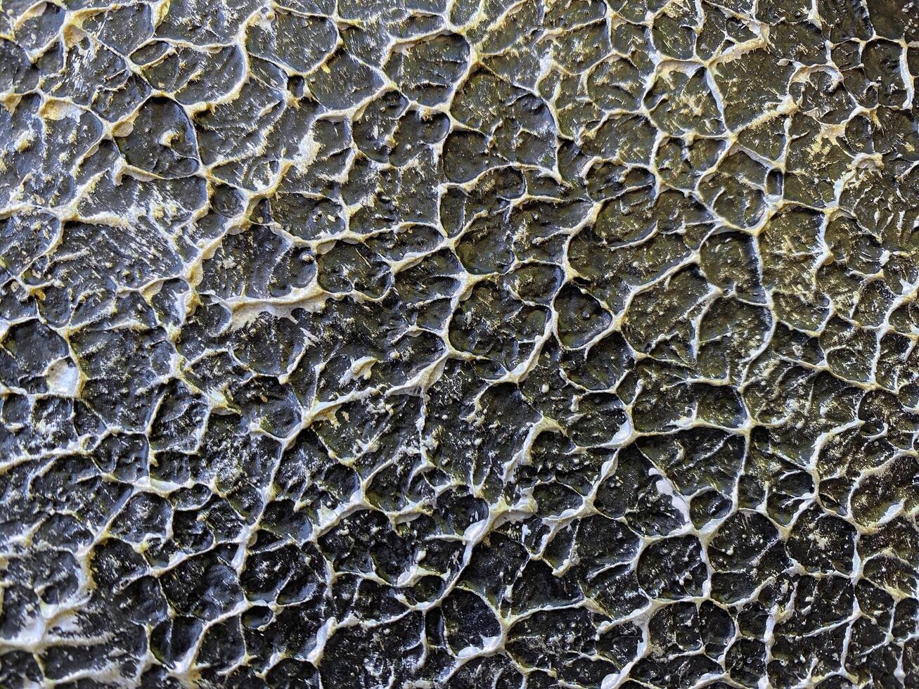 Cracked and cracked surface of a black surface photo