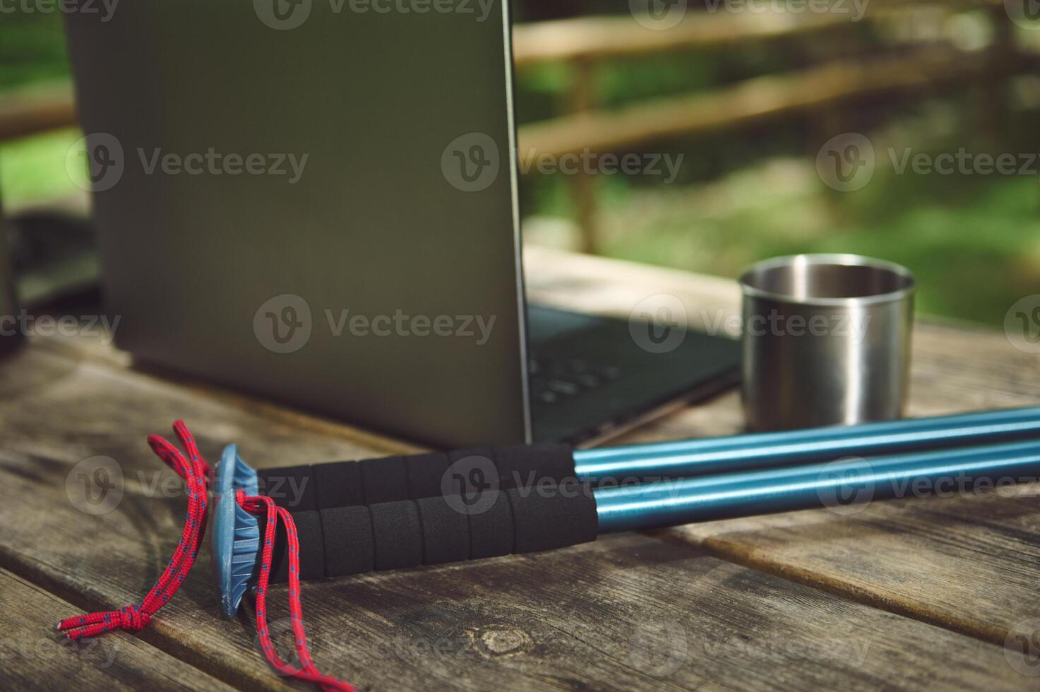Outdoor Equipment on Wooden Table in Nature Setting With Camping Vibes photo