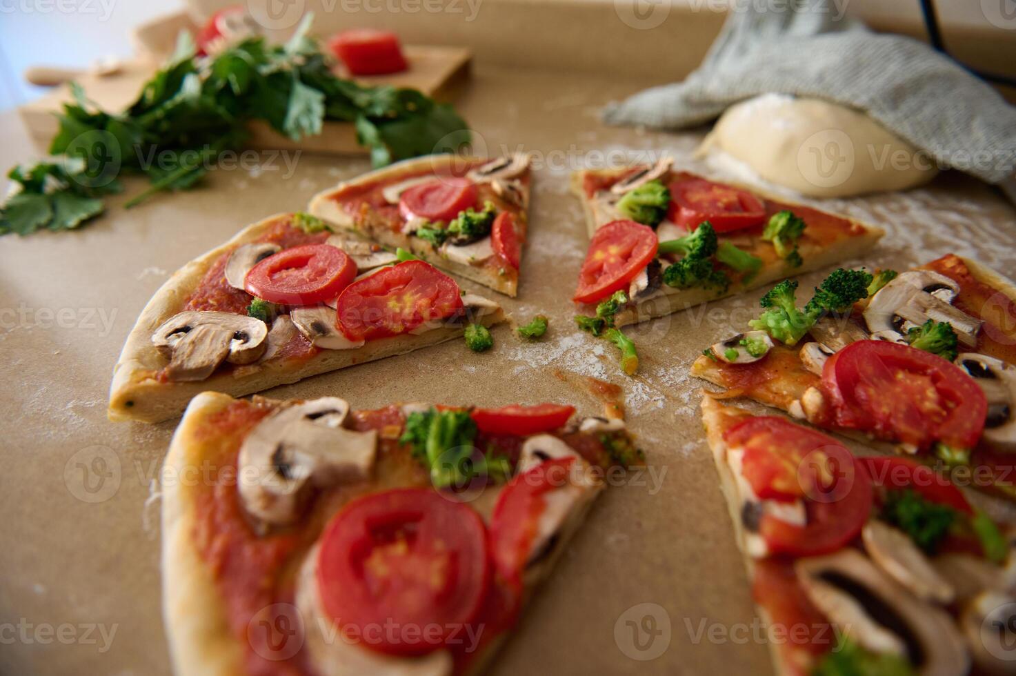 Freshly Prepared Slices of Vegetarian Pizza with Tomatoes and Mushrooms photo