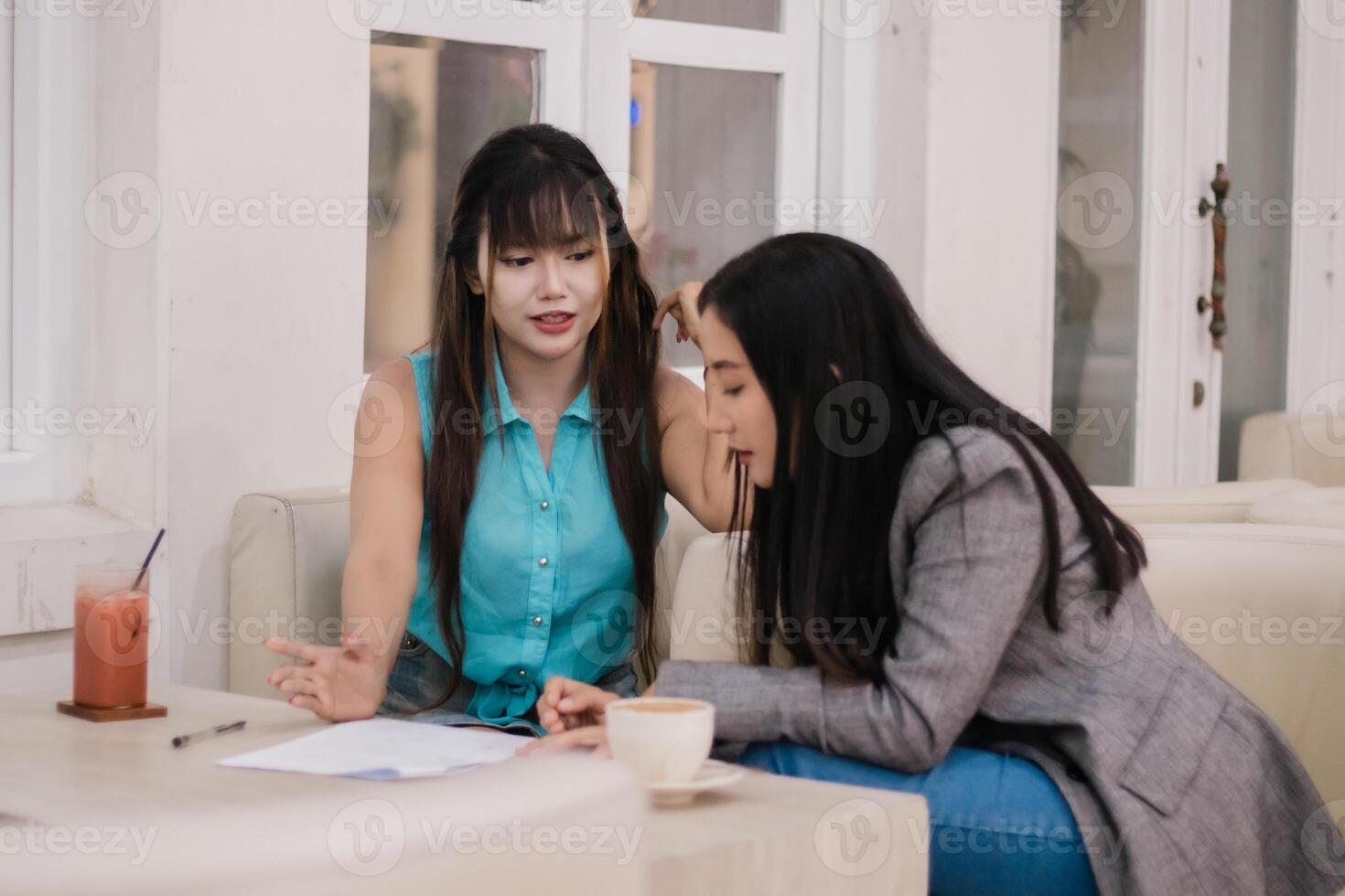 Co-workers Discussing Business Ideas at Cafe photo
