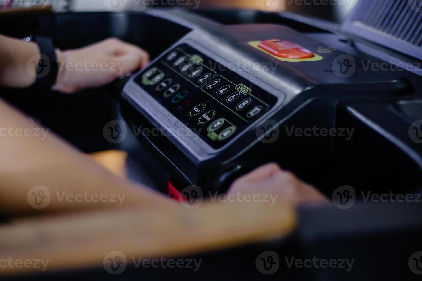 Hands control the treadmill, exercising for health improvement photo