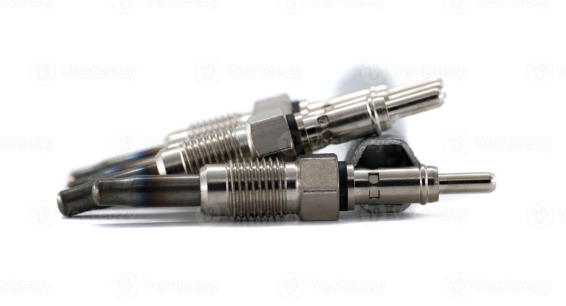 Group of new glow plugs for a diesel engine, isolated on a white background. photo